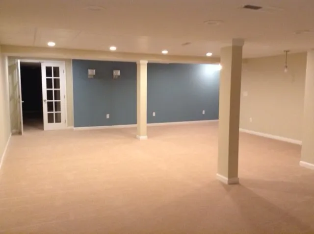 Finished basement remodel project with recessed lighting