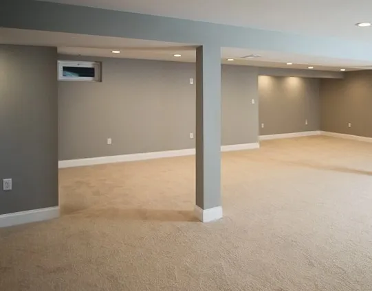 Finished basement remodel with gray walls, carpet, and recessed lighting